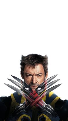 the wolverine poster has been altered to look like he is holding two large knives