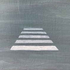 three white steps painted on a gray background with the shadow of one person's foot