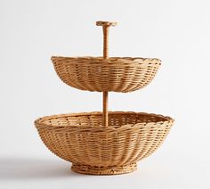 two wicker baskets stacked on top of each other in the shape of three tiers