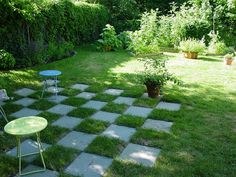 an outdoor area with grass and lawn furniture