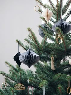 the ornaments are hanging from the christmas tree