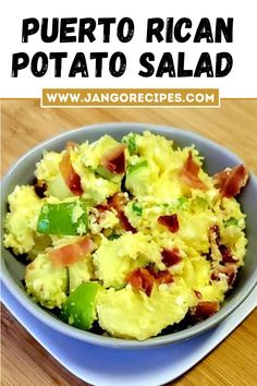 a bowl filled with potato salad on top of a wooden table