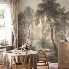 a dining room with a painting on the wall