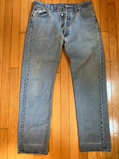 This pair of Vintage 501XX Levis Button-fly Jeans W33 L32 are a light-medium wash. They are in great condition, but have slight wear from use, and specifically some distressing/small holes in the crotch/fly area (shown in photos). Everyday Light Wash Jeans With Buttons, Classic Light Wash Jeans With Button Closure, Classic Medium Wash Jeans With Buttons, Jean Levis, Jean Vintage, Button Fly Jeans, Levis Jeans, Distressed Jeans, Mens Jeans