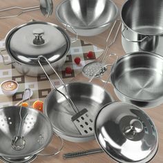 an assortment of pots and pans on a table