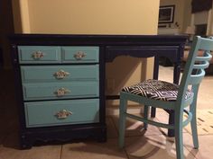 a blue desk with two chairs next to it