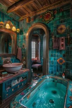 an ornate bathroom with blue tiles and a large jacuzzi tub in the center