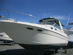 two white boats parked next to each other