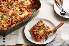 a casserole dish on a plate with a fork next to the casserole