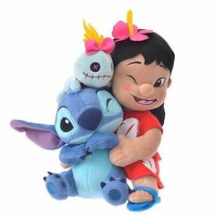 a girl hugging a stuffed toy with an elephant on her back