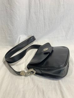 "Measurements are 7\" wide, 7\" high, 2\"3 deep with a 43\" shoulder strap. On the interior there is one main compartment with a back zipper pocket, lined in black vinyl with a front magnetic closure. This is a lovely Renoma shoulder bag with silver tone hardware and is a great vintage find. 100% genuine Renoma made in France. -----------------------------------------I SHIP WORLDWIDE------------------------------------------------- I want to stress that item is vintage which means it's not new. Vintage Evening Satchel With Adjustable Strap, Retro Satchel With Adjustable Strap For Formal Use, Retro Satchel With Adjustable Strap For Formal Occasions, Retro Formal Satchel With Adjustable Strap, Vintage Evening Shoulder Bag With Adjustable Strap, Vintage Satchel With Silver-tone Hardware, Vintage Travel Shoulder Bag With Silver-tone Hardware, Vintage Shoulder Bag With Silver-tone Hardware, Vintage Shoulder Bag With Silver-tone Hardware For Travel