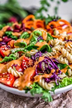 a plate full of pasta salad with dressing