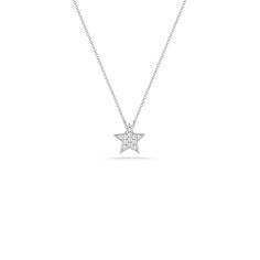 We're seeing stars! Our Julianne Himiko gold and diamond star necklace is what celestial dreams are made of. This single star pendant is adorned with pavé-set diamonds and hangs on a delicate diamond cut cable chain. Delicate and dainty, this charming necklace is perfect for layering. This is the must-have piece for all the Astrology lovers out there. It is available in 14k white, yellow, and rose gold with a spring-ring clasp and a sparkling mini-chain. The pendant is always white gold to show Star-shaped Diamond White Necklace With Single Cut Diamonds, Star Shaped Diamond Necklace With Single Cut Diamonds, Star-shaped Diamond Necklace With Single Cut Diamonds, Luxury Star-shaped Diamond Necklace, White Gold Star Necklace Fine Jewelry, Diamond Star Charm Necklace, Fine Jewelry White Gold Necklace With Star Charm, Celestial Diamond Star Charm Necklace, Celestial Diamond Necklace With Star Charm