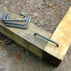 an old wooden bench with nails stuck in it and the words ebay below it