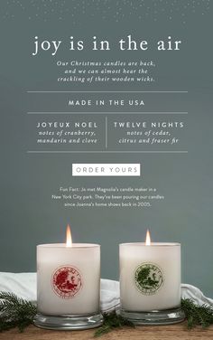 two candles sitting on top of a table next to each other with the words joy is in