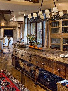 a large wooden table sitting in the middle of a living room