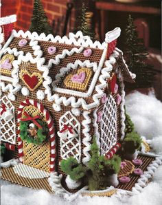 a cross stitch gingerbread house ornament