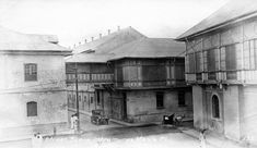 an old black and white photo of some buildings