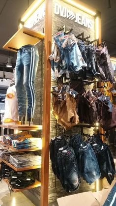 there are many pairs of jeans on display