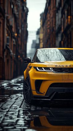 a yellow range rover parked in the middle of an alleyway on a rainy day