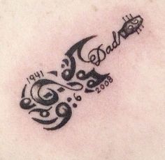 a tattoo with the word dad written on it