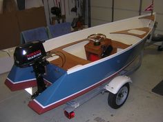 a small motor boat is parked in a garage