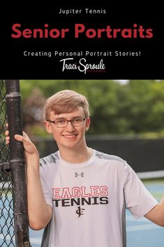 a young man holding onto a tennis racket