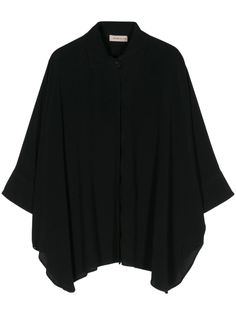 black crepe texture classic collar batwing sleeves asymmetric hem concealed front button fastening Chic Oversized Asymmetrical Blouse, Elegant Oversized Blouse With Shirttail Hem, Black Blouse With Asymmetrical Hem For Work, Elegant Oversized Black Cape, Elegant Black Oversized Cape, Black Viscose Office Blouse, Oversized Blouse For Work, Batwing Sleeve Blouse For Work In Fall, Elegant Batwing Sleeve Top For Workwear