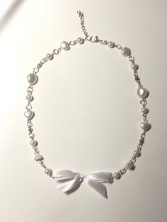 Handmade necklace with a white ribbon bow Beaded Ribbon Necklace, Aesthetic Y2k, Ribbon Necklace, Bow Necklace, Handmade Beaded Necklaces, White Ribbon, Ribbon Bows, Handmade Necklaces, Ribbon