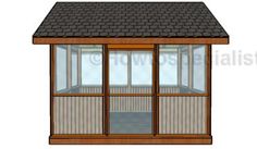 a small wooden building with glass doors