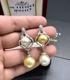 We are presenting you a HUGE pair of CHANDELIER, Genuine, Golden & White South Sea Pearls, extremely FINE A+, LUSTROUS and Rare! Accenting the 4 pearls are 110 pieces of F/VS Natural diamonds, weighting a total of 1.30 carats. Set in fabulously designed 18K solid white gold, chandelier earrings ONLY ONE ITEM AVAILABLE!! NO DUPLICATES!! WHAT YOU SEE IN THE PICTURES IS WHAT YOU WILL GET SOLIDLY HANDCRAFTED EARRINGS! SUGGESTED RETAIL VALUE: $8,500 PEARLS: Size: Bottom 14 x 15 mm, top 12 mm roun Luxury White Gold Teardrop Pearl Earrings, Luxury Yellow Gold Teardrop Bridal Earrings, Luxury Yellow Gold Drop Pearl Earrings, Luxury White Gold Drop Pearl Earrings, Luxury Yellow Dangle Earrings, Elegant White Pear Shaped Earrings, White Drop Luxury Jewelry, Luxury Yellow Teardrop Earrings, Luxury White Drop Jewelry