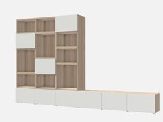 a white and brown bookcase sitting on top of a wooden shelf