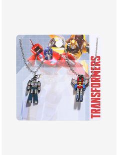 two necklaces with lego characters on them in front of a card that says,