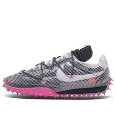 Finally, a women's sneaker that doesn't sacrifice style for comfort. The Nike Womens WMNS Waffle Racer SP is the best of both worlds, with a chic design and comfortable construction that will make this your go-to shoe all season long. The black upper is accented by a full translucent screen, secondary laces anchored by fuchsia cables, and a branded heel tab, while the lateral Swoosh picks up an orange flag for a pop of color. The foam midsole and bold spiked Waffle outsole provide both style and Nike Waffle Racer, Yeezy 750, Off White Nike, Off White Fashion, Nike Off White, Nike Waffle, Baskets Nike, Marathon Running Shoes, Nike Dunk High