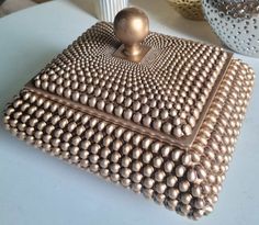 a brown purse sitting on top of a table