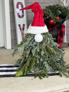 a christmas tree with a santa hat on top