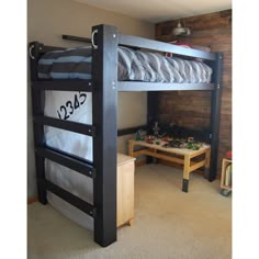 a bunk bed in a room with wooden walls and carpeted flooring on the floor