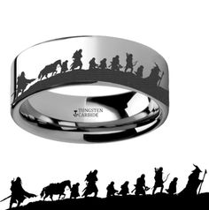 a ring with the silhouettes of people riding horses and riders on it in black and white