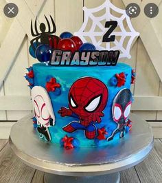 a spiderman birthday cake on top of a table