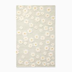 a white rug with flowers on it