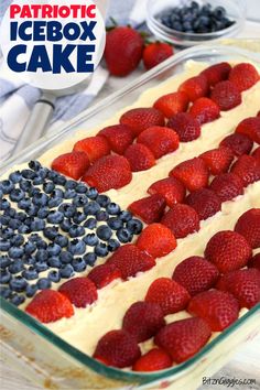 an american flag cake with strawberries and blueberries