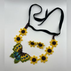 Description: Oversized Statement Butterfly & Flower Necklace With Matching Earrings These Items Are Individually Made With Love By Me. Details: Handmade Colors: Yellow, Black, Brown, & Green Design: Butterfly Material: Seed Bead Necklace Length: Adjustable Earrings Length: 1.2" Style: Boho/ Hippie/ Butterfly / Statement / Flirty / Daisy Care Instructions: Store Out Of Direct Sunlight And Keep Away From Water. It Is Not Recommended To Wear It In Or Around Water Yellow Bohemian Jewelry With Sunflower Design, Bohemian Yellow Jewelry With Sunflower Design, Bohemian Yellow Sunflower Design Jewelry, Adjustable Yellow Sunflower Design Jewelry, Handmade Yellow Jewelry For Summer, Black Flower Jewelry For Summer, Yellow Jewelry For Summer Gifts, Yellow Summer Jewelry Gift, Daisy Care