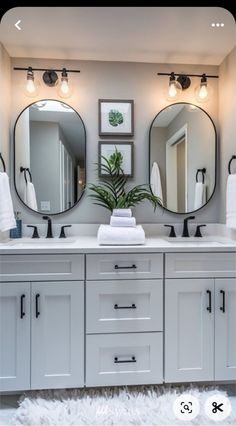 a bathroom with double sinks and mirrors on the wall above them is shown in this image