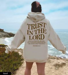 "Trust in the Lord Christian Hoodie 👉 QUICK FACTS 👈 50% cotton/ 50% polyester fabric blend Runs true to size. 👉HOW TO ORDER:👈 1. Please, Check and Review all Photos. 2. Select Your Size and Color from drop down menus. 3. Choose Your Quantity as much as you want. 4. Click \"Add To Cart\". For multiple items go back to the listing and repeat the steps. 👉Sizing Chart 👈 Use the sizing chart to understand the measurement of our Hoodies. 👉Care Instructions 👈 Machine wash: warm (max 40C or 105F Love Like Jesus, Trust In The Lord, Letter Print Hoodie, Christian Sweatshirt, Faith Over Fear, Hoodie Outfit, Jesus Shirts, Women Hoodies Sweatshirts, Letter Print