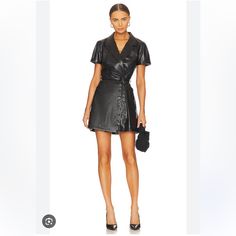 Nwt. Paige Womens Black Lowen Belted Faux-Leather Mini Dress We Know What You’re Thinking, Denim Devote Paige Only Whips Up Endless Styles Of Jeans. But That Couldn’t Be Further From The Truth. The La Native Has A Roster Of Ready-To-Wear Garms Like The Lowen Dress Up Its Sleeve. Fashioned From Faux Leather, The Mini Style Is Shaped To A Classic A-Line Silhouette, With A Plunging Collared V-Neck And Self-Tie Belt To Cinch You In The Waist. Size Small Small Mark On Bottom Back Of Dress Shown In Pi Trendy Faux Leather Spring Dress, Chic Faux Leather Mini Dress For Summer, Chic Faux Leather Summer Mini Dress, Leather Evening Dresses For Summer, Elegant Leather Dresses For Going Out, Spring Leather Workwear Dress, Chic Leather Workwear Dress, Spring Leather Dress For Work, Sleek Mini Dress For Spring Workwear