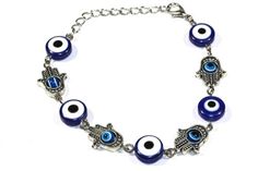 This stunning and powerful silver-tone bracelet combines the Hand of Fatima or Hamsa Hand with the Evil Eye for maximum protection. The Hand of Fatima wards off negative influences and energies, while the Evil Eye provides protection against jealousy and envy. Length: 7.5 inches with 1.5 inch extender Lobster clasp closure Base metal Free Shipping! Evil Eye Bracelet Silver, Hand Evil Eye, Energy Jewelry, The Evil Eye, Hamsa Bracelet, Aquamarine Bracelet, Hand Bracelet, Hand Of Fatima, Evil Eye Bracelet