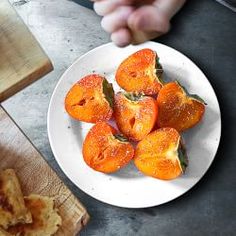 a white plate topped with cut up carrots