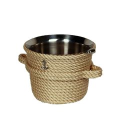 a large metal bowl with rope wrapped around the bottom and an anchor on the side