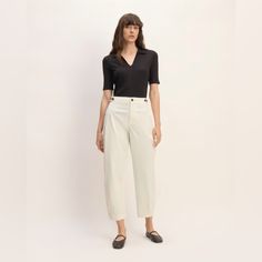 About This Style. This Piece Features A High Rise, Barrel Leg, Regular Length, Zipper Closure, Waistband Buttons On The Side Seams For Adjustability, In Organic Cotton. Fit High-Rise Inseam: 27" Waist Measures Apr. 16” Across Materials 98% Organic Cotton, 2% Elastane Care Machine Wash Cold With Like Colors. Only Non-Chlorine Bleach When Needed. Tumble Dry Low. Warm Iron When Needed. New Without Tags; Never Worn Everlane Casual High Waist Pants, Everlane Cotton Bottoms For Workwear, Chic Cotton Bottoms By Everlane, Chic Everlane Cotton Bottoms, Spring Workwear Tops With High Waist, Spring High Waist Bottoms By Everlane, Fitted High Waist Tops For Workwear, Fitted Cotton Bottoms By Everlane, Everlane Chic Relaxed Fit Bottoms