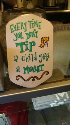 a sign that says every time you don't tip a child gets a munt